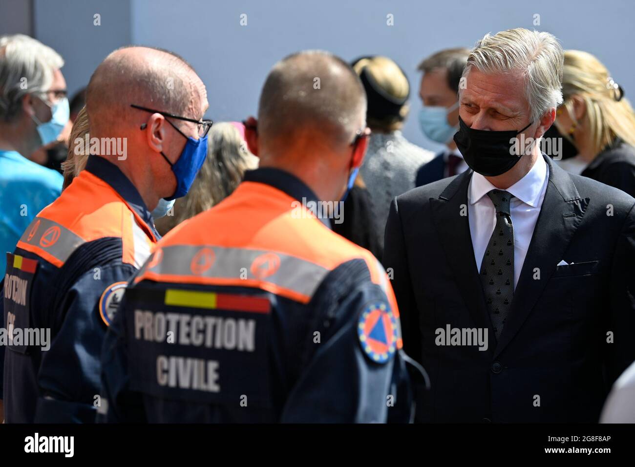 King Philippe - Filip of Belgium and Protection Civile - Civiele Bescherming workers pictured at a tribute ceremony with a minute of silence, part of Stock Photo