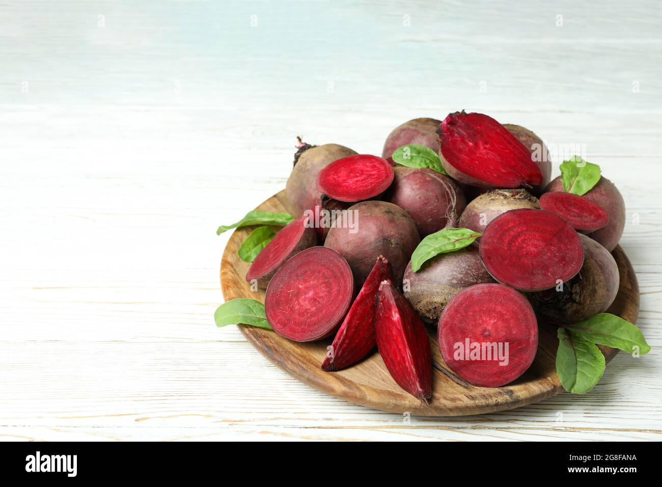 Ripe red beet on white wooden table Stock Photo
