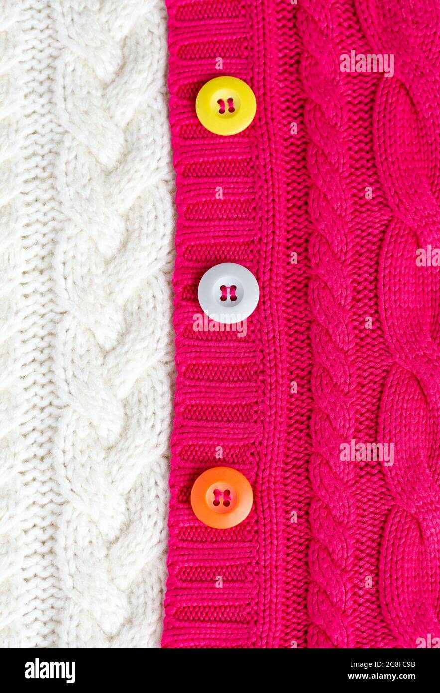 Knitted sweaters white and red and multi-colored buttons. Textures ...