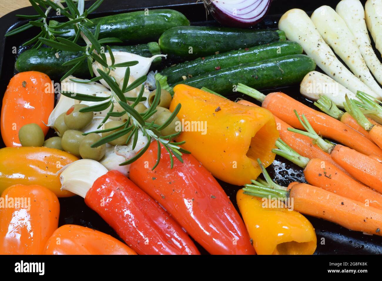 Prepped vegetables on a grilling tray ready for the oven. Stock Photo