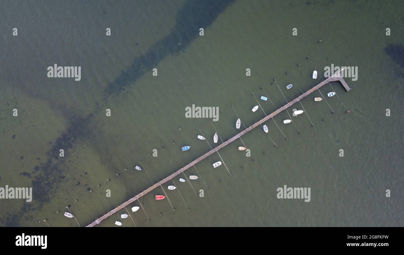 Aerial view of small boats moored on a pier in Poole harbour from ...