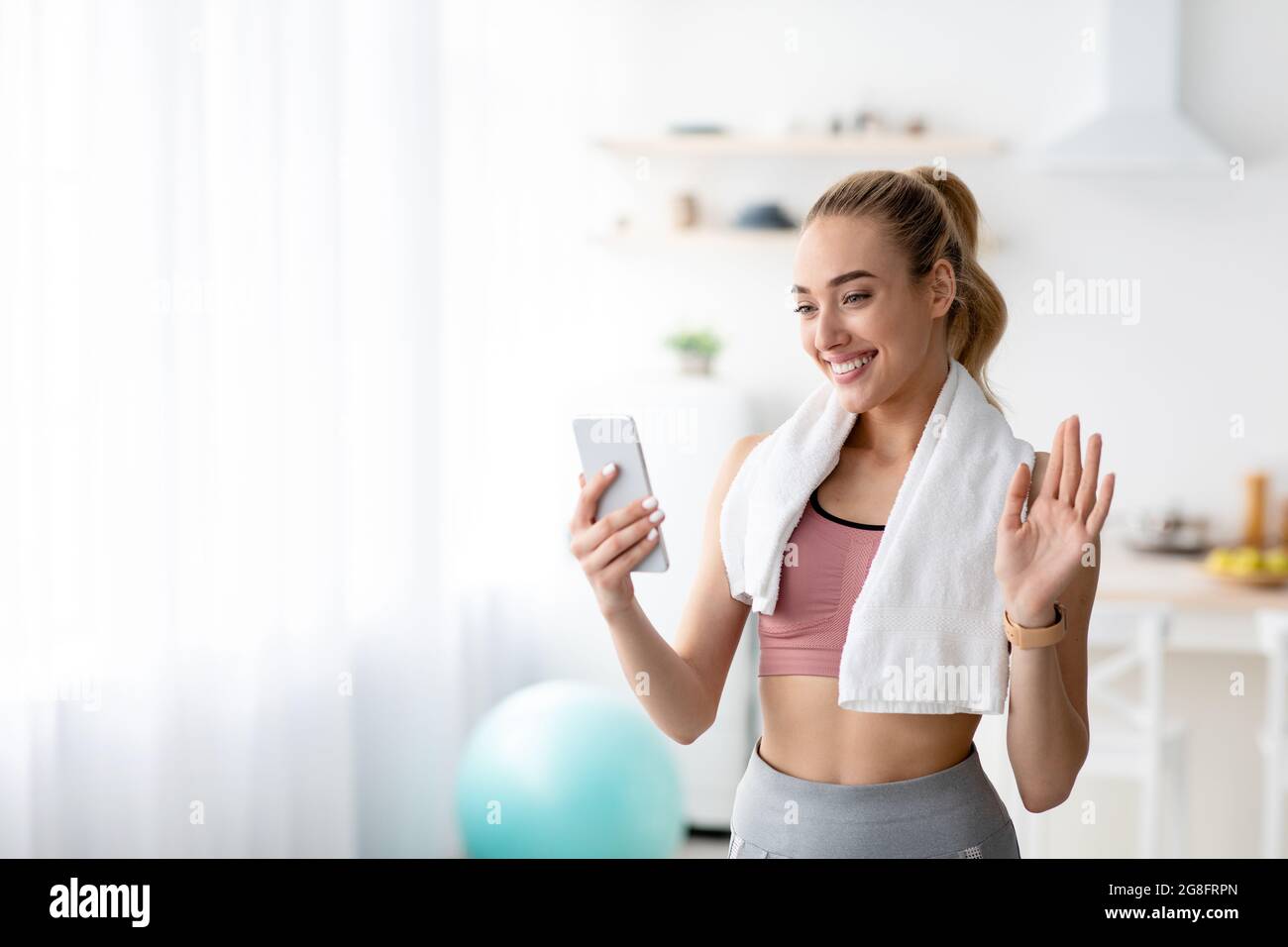 Online call and fitness blog, modern tech for chat, body care and workout with coach Stock Photo