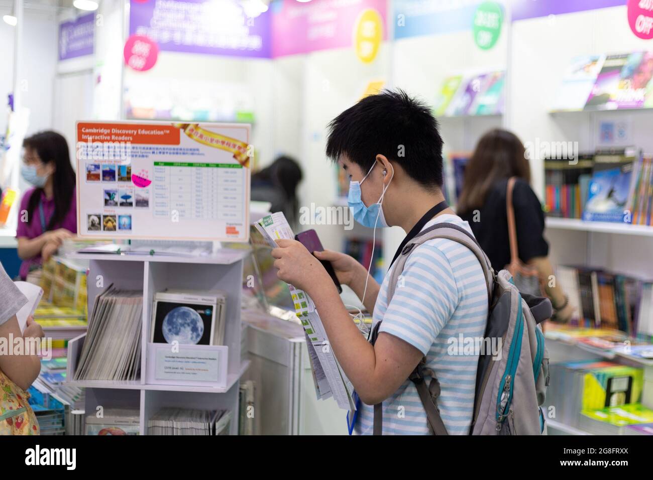 18 07 2021 People with face masks read and buy books in Hong Kong Book