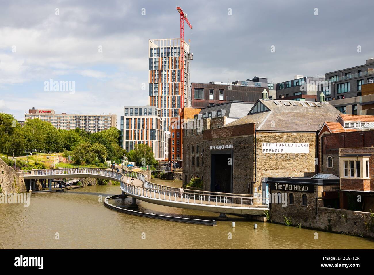 The bendy Castle Bridge between the Left Handed Giant Brewpub and The Wellhead public house to Castle Park. Bristol. England Stock Photo