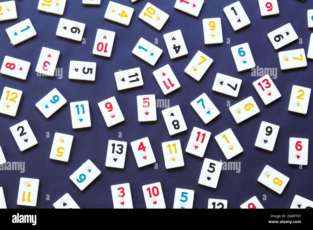 rummikub tiles isolated on black background, top view of game tiles