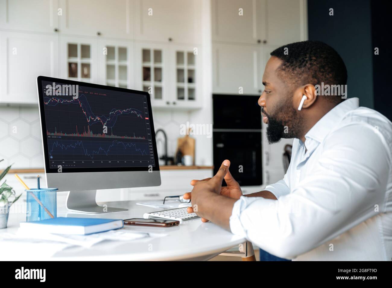 Investments, trading on the stock exchange. African american man trader  investor, is analysing cryptocurrency financial market, looks at computer, trading data index chart graph on pc screen Stock Photo - Alamy