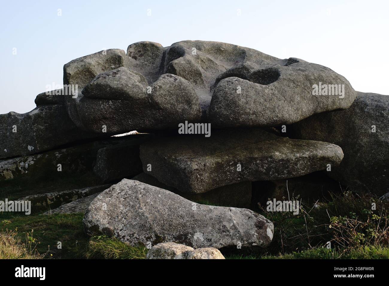 carved eroded rock formation stacked on top of other rocks boulders Stock Photo