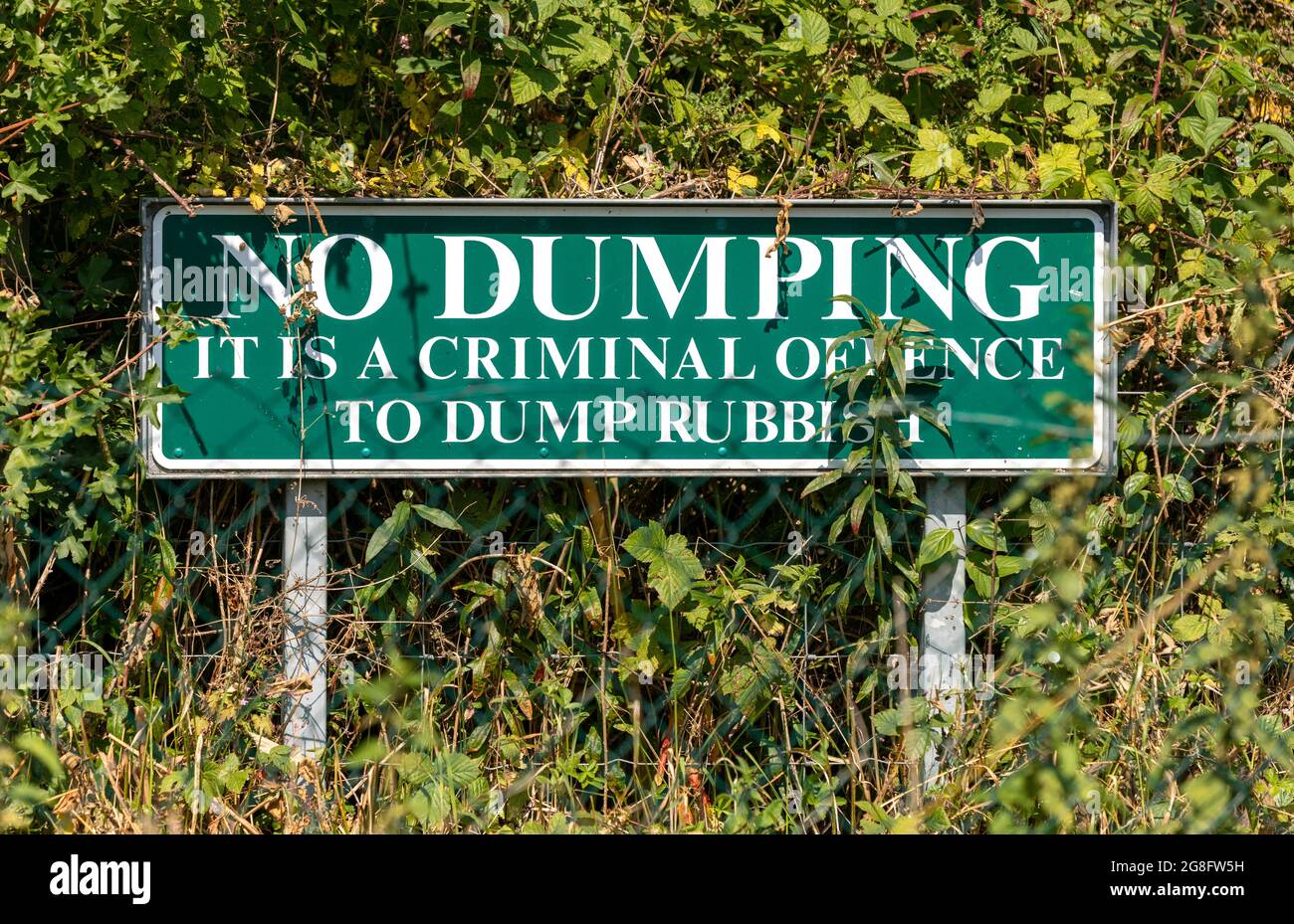 No dumping rubbish warning sign in a country footpath in rural Gloucestershire,  the cotswolds, UK Stock Photo