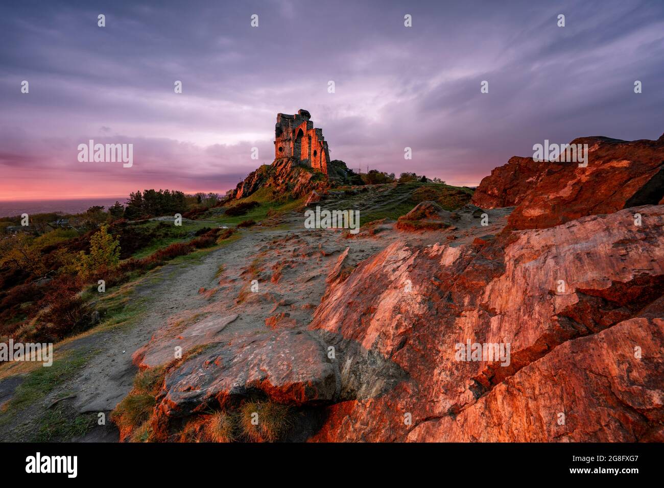 The Folly at Mow Cop illuminated by amazing sunset, Mow Cop, Cheshire, England, United Kingdom, Europe Stock Photo