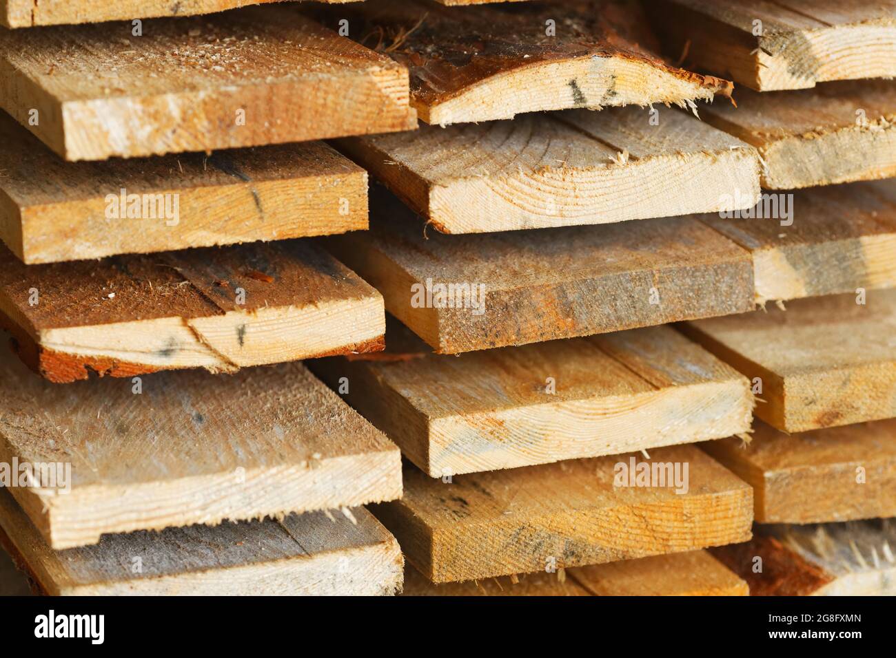 Boards and construction lumber lie in the carpentry