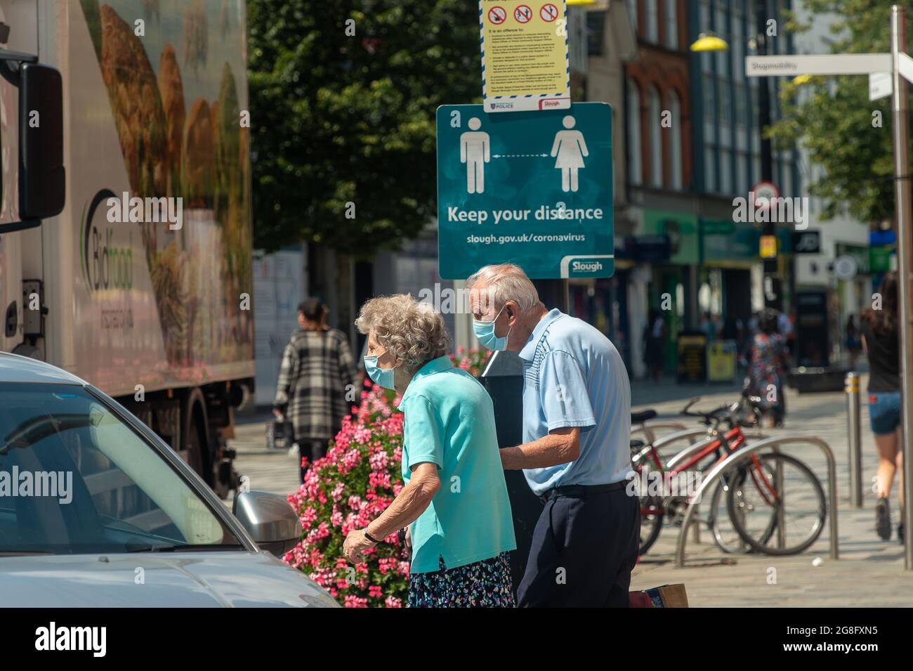 Elderly couple putting face masks hi-res stock photography and images ...