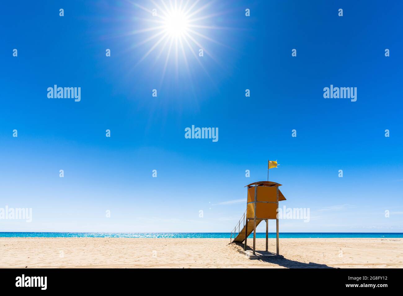 Sun shining over the lifeguard's cabin by the ocean, Morro Jable, Fuerteventura, Canary Islands, Spain, Atlantic, Europe Stock Photo