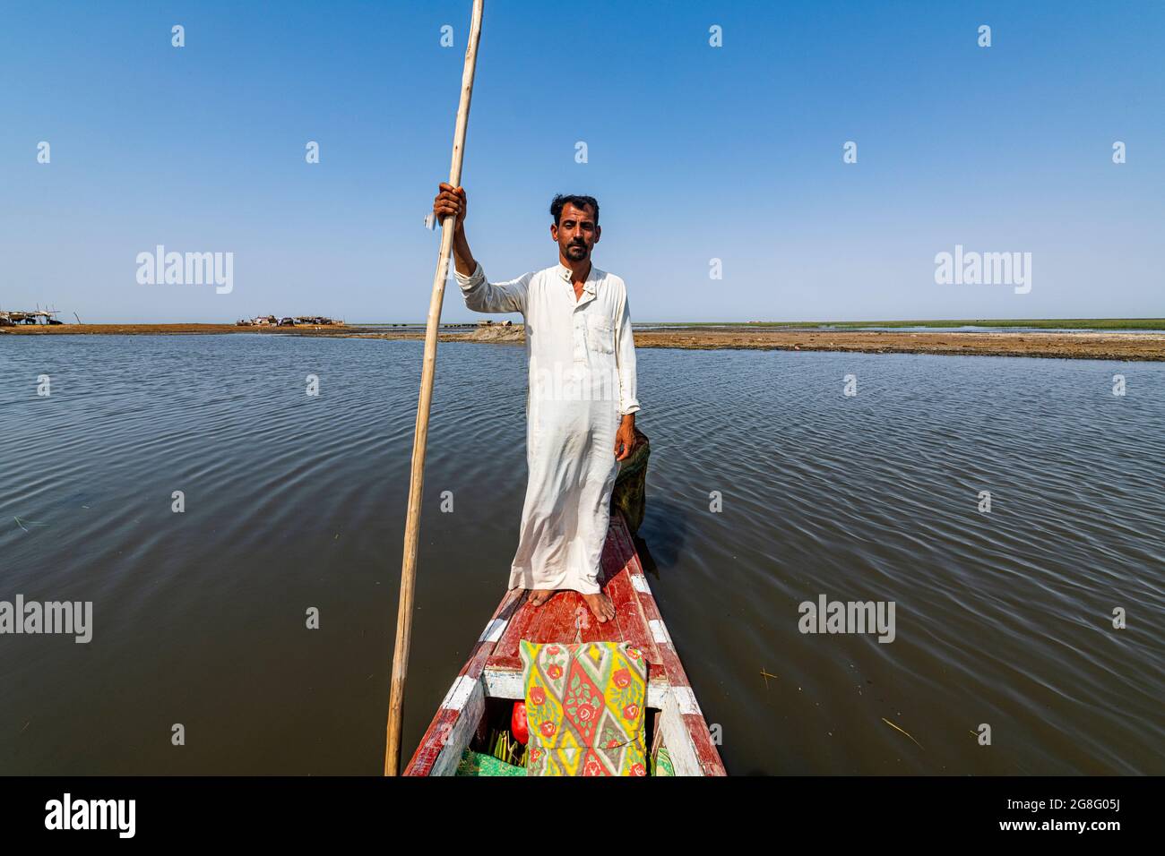 Marsh Arab on his boat, Mesopotamian Marshes, The Ahwar of Southern Iraq, UNESCO World Heritage Site, Iraq, Middle East Stock Photo