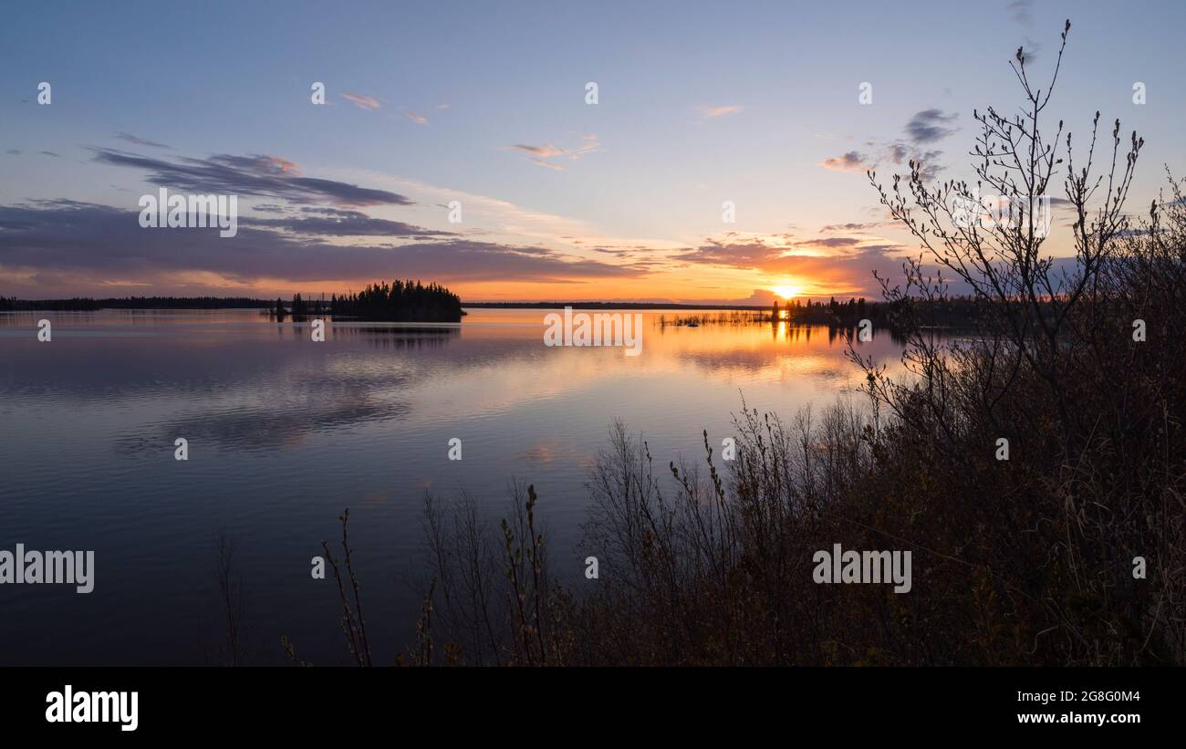 Colourful sunset in Spring at Astotin Lake, Elk Island National Park, Alberta, Canada, North America Stock Photo