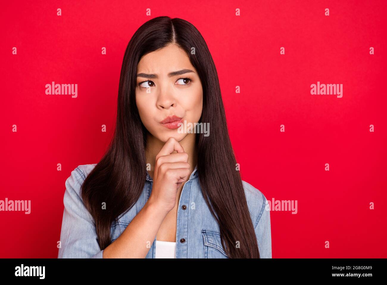 H.M.M. asian Photo of young attractive asian girl think hmm deep minded idea hand touch  chin look empty space isolated over red color background Stock Photo - Alamy