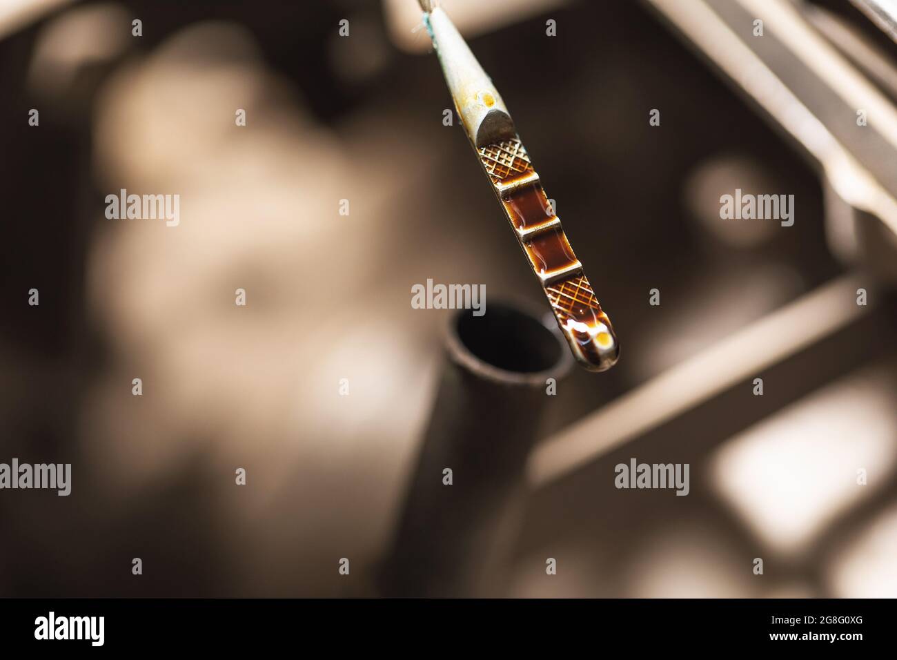 Closeup of used engine oil level on the dipstick Stock Photo Alamy