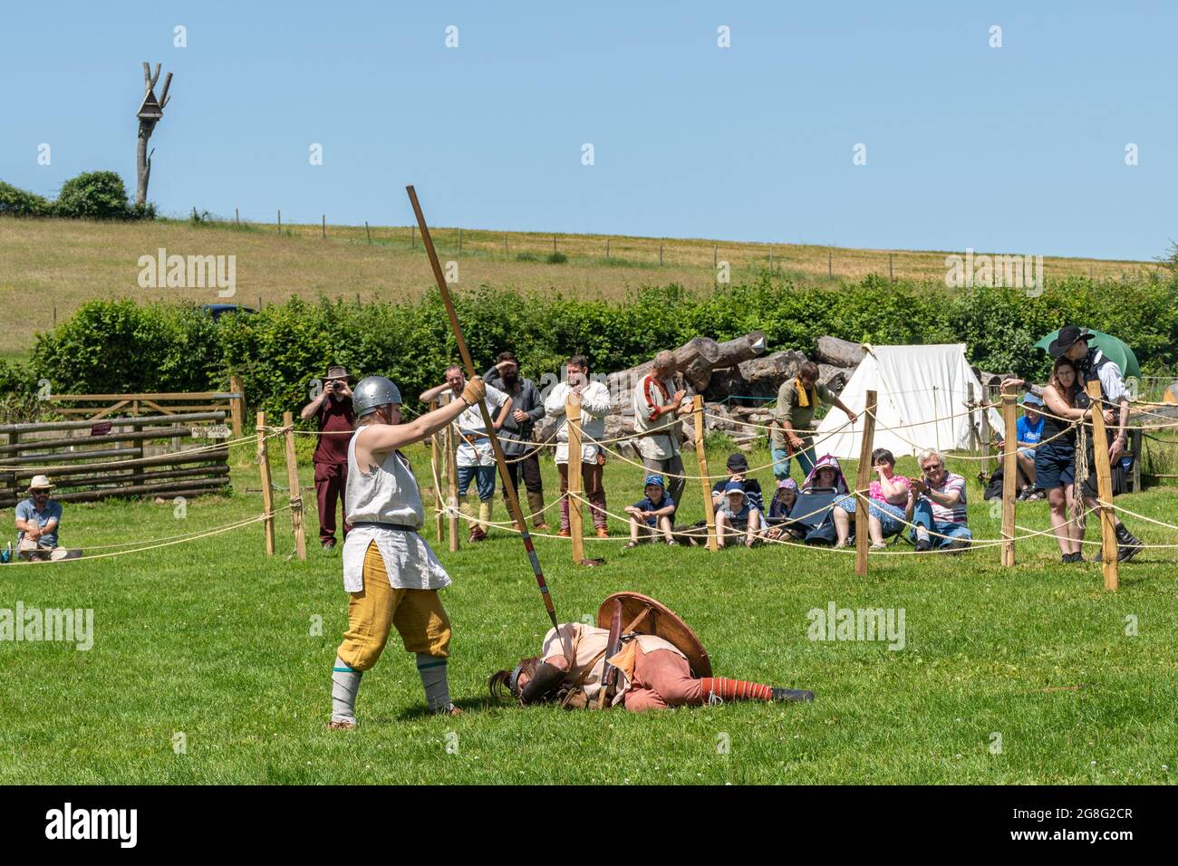 Herigeas Hundas, Anglo-Saxon reenactment society battle display at Butser Ancient Farm archeological open air museum in Hampshire, England, UK Stock Photo