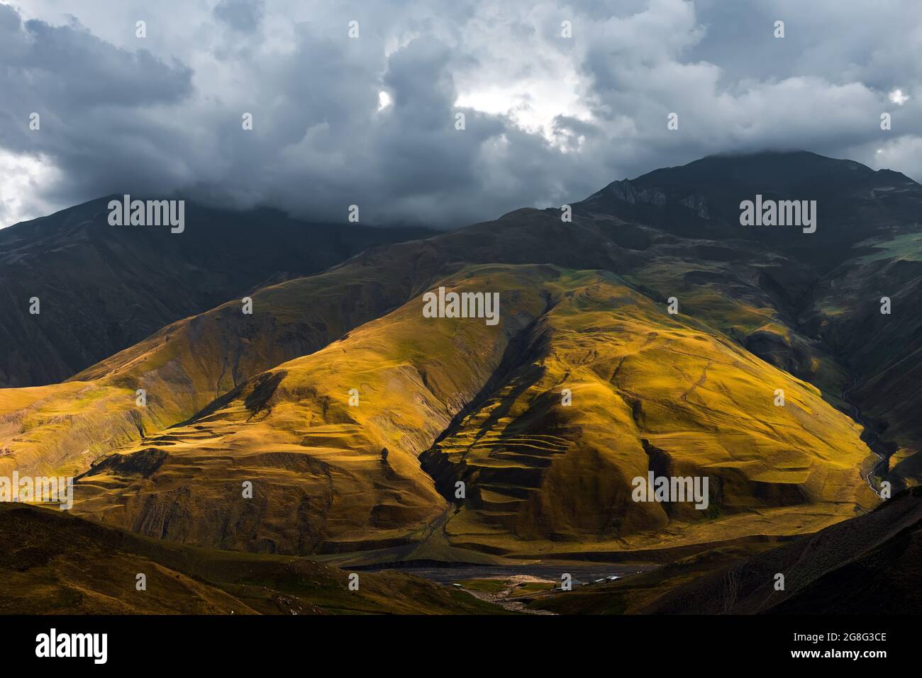 Mountains illuminated by setting sun Stock Photo