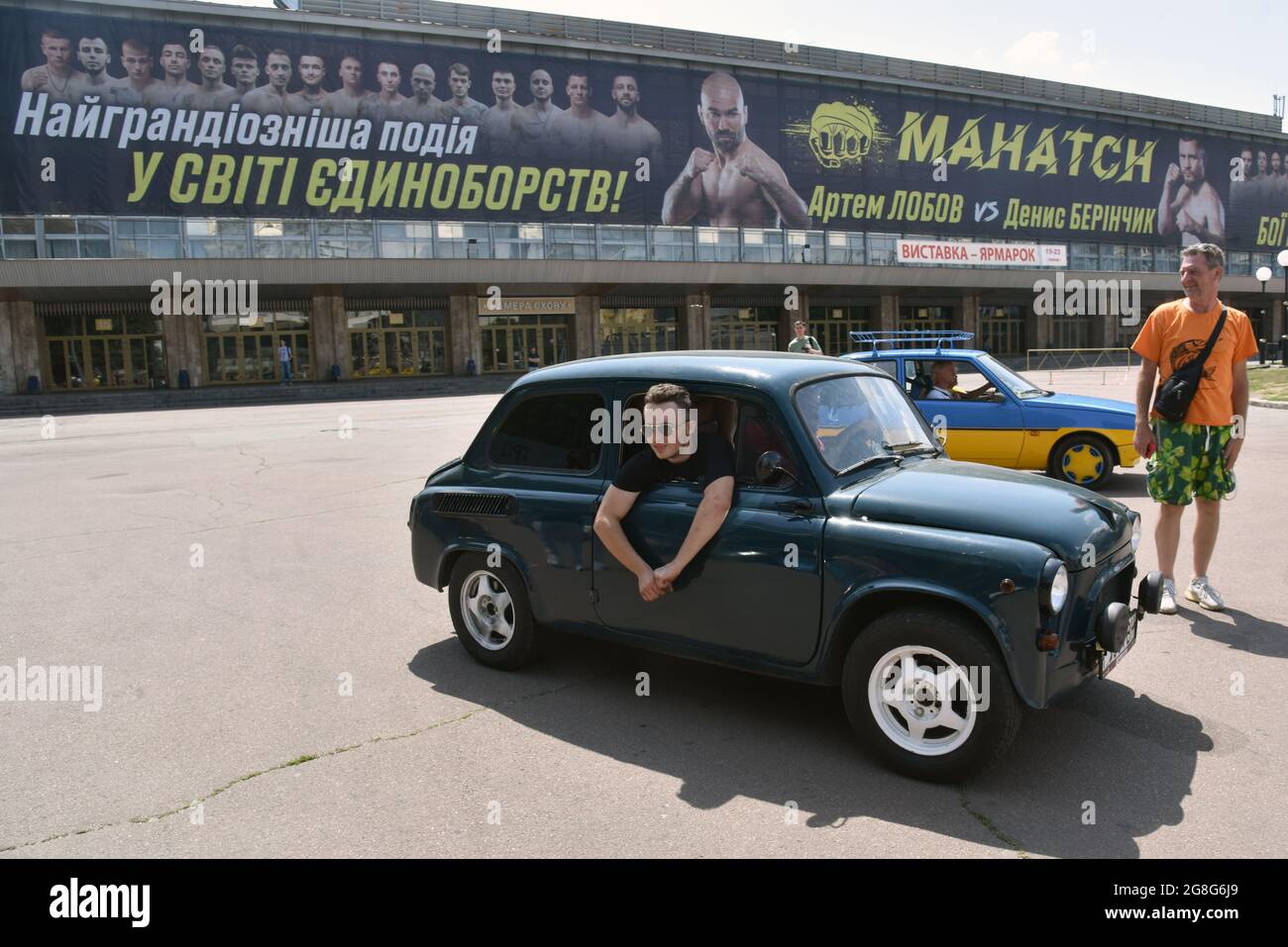 Non Exclusive: KYIV, UKRAINE - JULY 17, 2021 - A man sticks out of a side window during the show of the 1960-1994 ZAZ cars celebrating 20 years since Stock Photo
