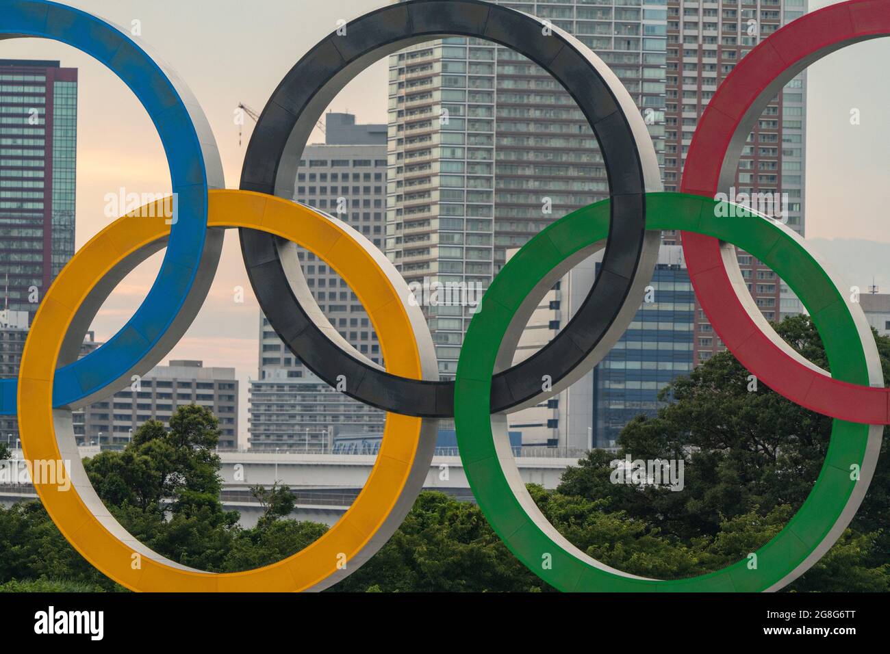 Tokyo, Japan. 20th July, 2021. The Olympic rings frame high rises along Tokyo Bay in the Shinagawa district before the start of the Tokyo Olympics, in Tokyo, Japan on Tuesday, July 20, 2021. Photo by Richard Ellis/UPI. Credit: UPI/Alamy Live News Stock Photo