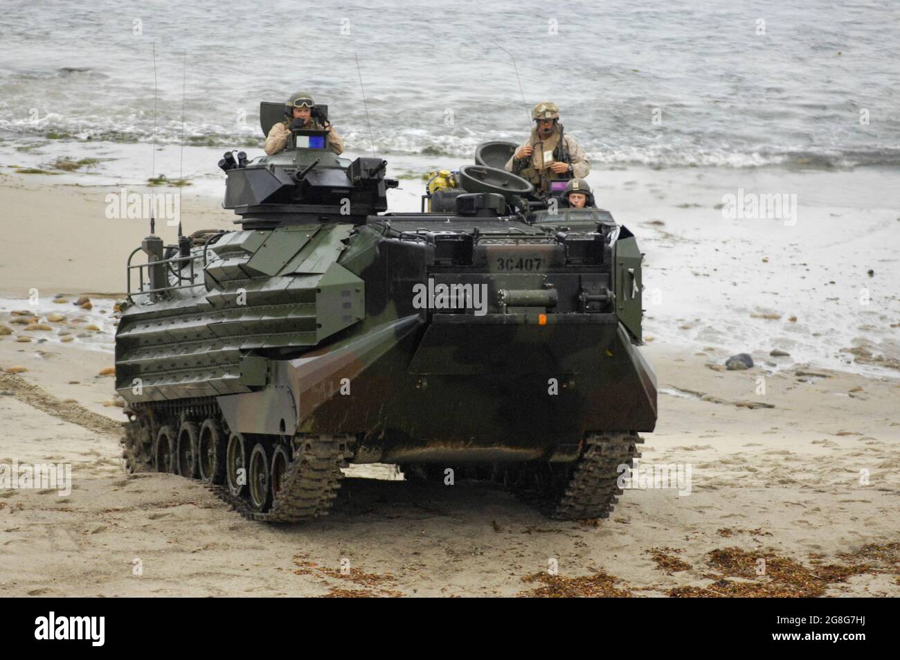 USMC Assault Amphibious Vehicle (AAV) is out of the surf and on the beach at MCB Camp Pendleton, ready to head inland Stock Photo