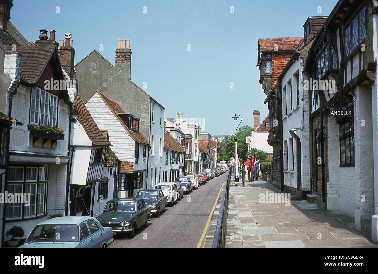1975, exterior view from this era of the various historical old houses in All Saints Street in the Old Town of Hastings, East Sussex, an ancient port and coastal town on the South Coast of England, UK. The shingle beach in the town, the Stade - Saxon for landing place - has the biggest beach-launched fishing fleet in Europe. Stock Photo