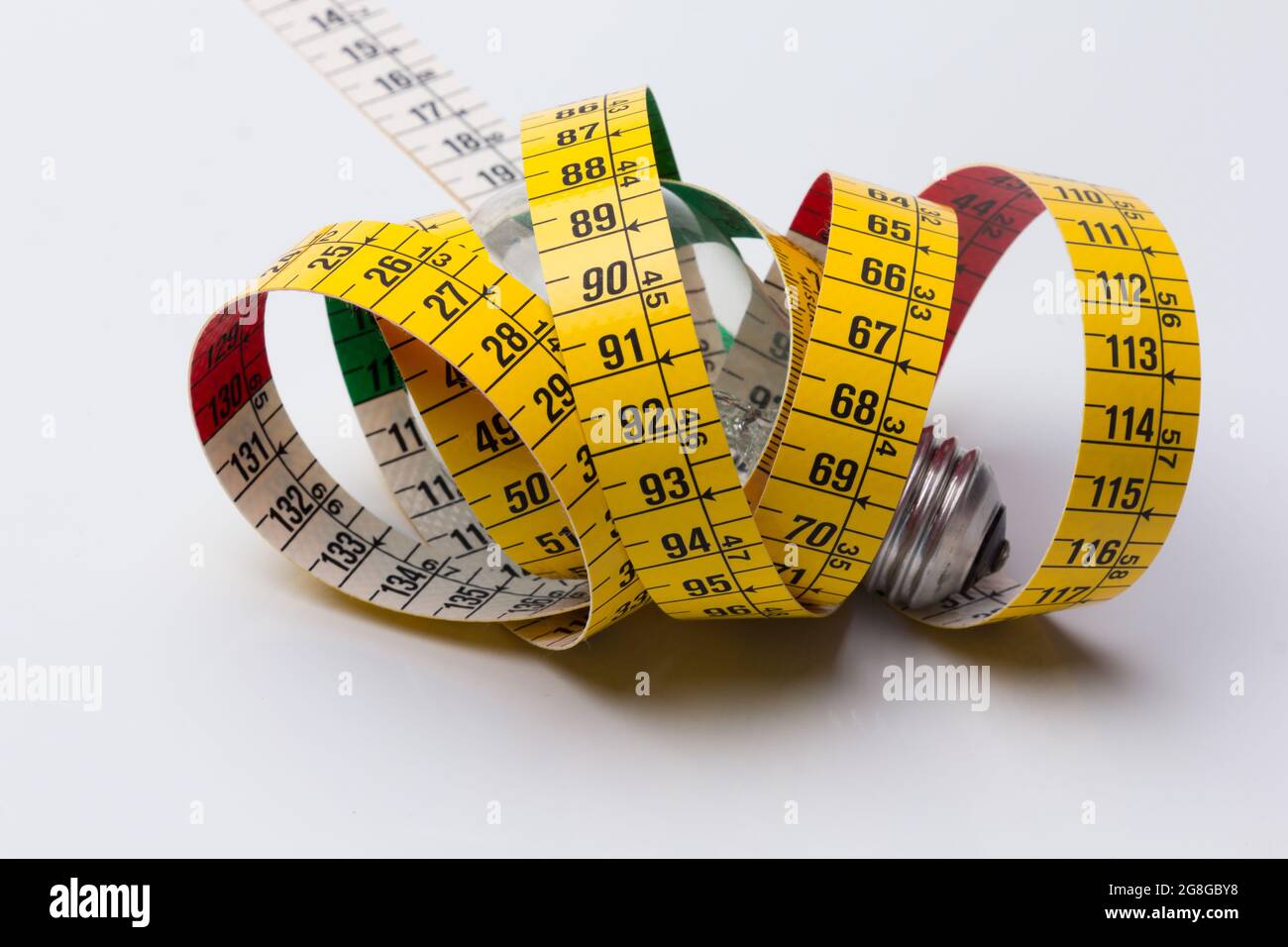 Yellow flexible tape measure Stock Photo - Alamy