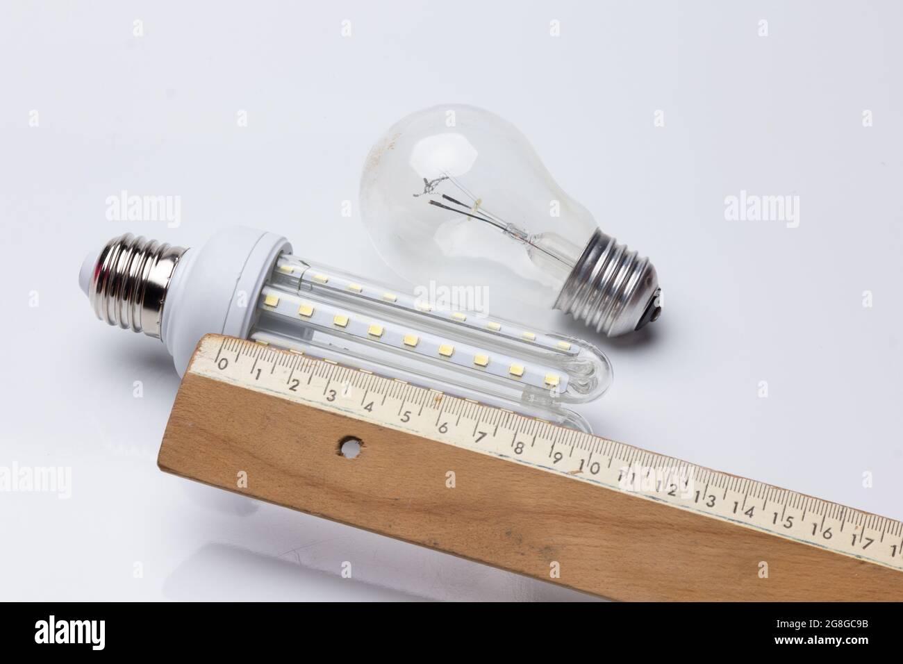 Energysaving light bulb and classic incandescent bulb with high energy consumption; Ecology