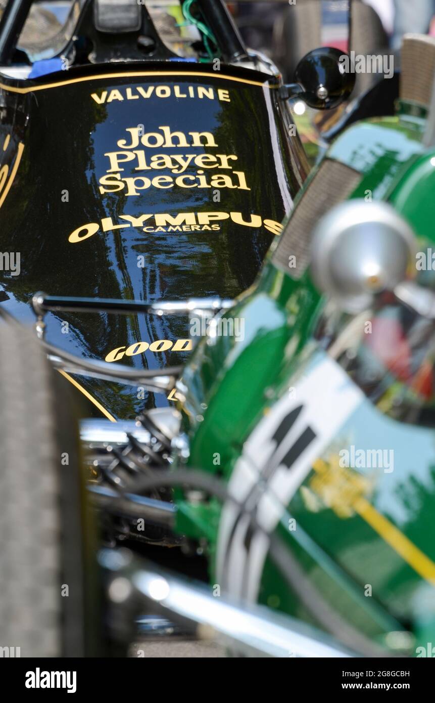 Detail of a 1970s Lotus 79 with John Player Special sponsorship behind a 1960s vintage green Lotus at the Goodwood Festival of Speed event, UK Stock Photo