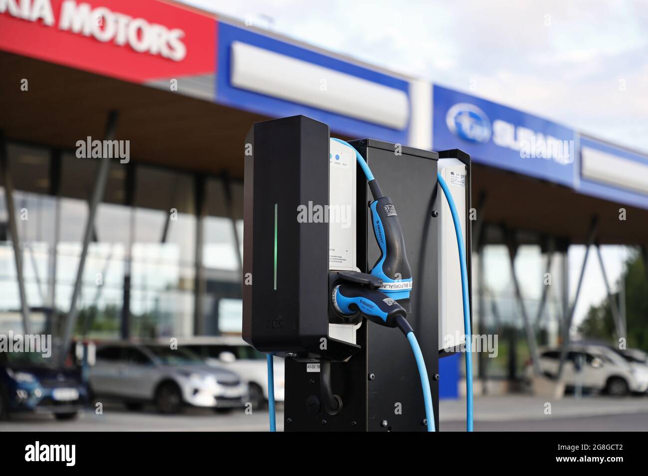 Charging station at a Kia motors and a Subaru car dealership Stock