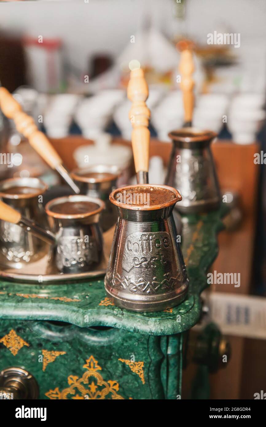 Turkish coffee brewed on sand in cezve. Oriental, east coffee Stock