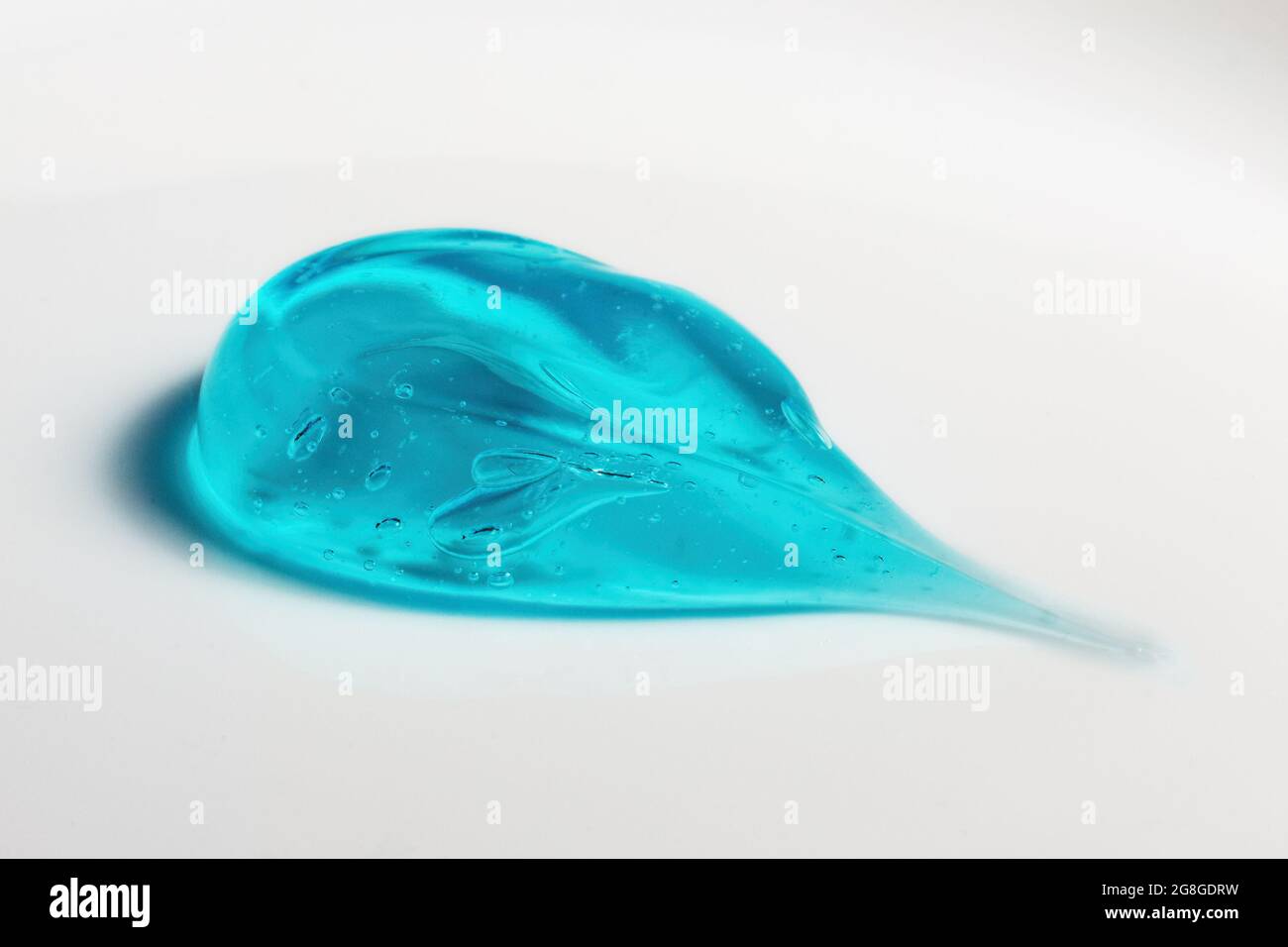 Squeezed cosmetic clear cream gel texture Iisolated on white background. Close up transparent