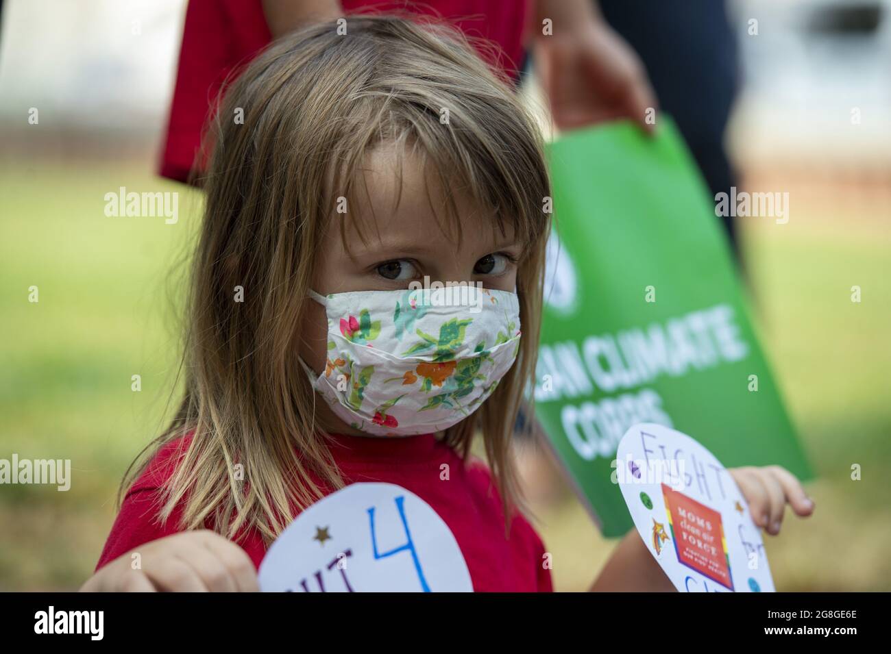 Natalie Bednar, 5, looks on during a news conference encouraging the inclusion of the Civilian Climate Corps into the upcoming reconciliation bill at the US Capitol in Washington, DC., on Tuesday, July 20, 2021.      Photo by Bonnie Cash/UPI Stock Photo