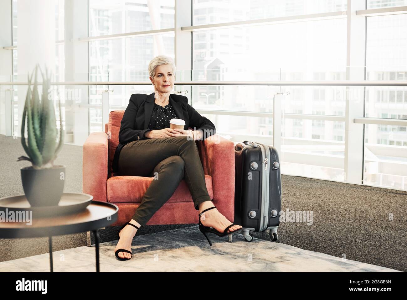 Unwinding during her business travel Stock Photo