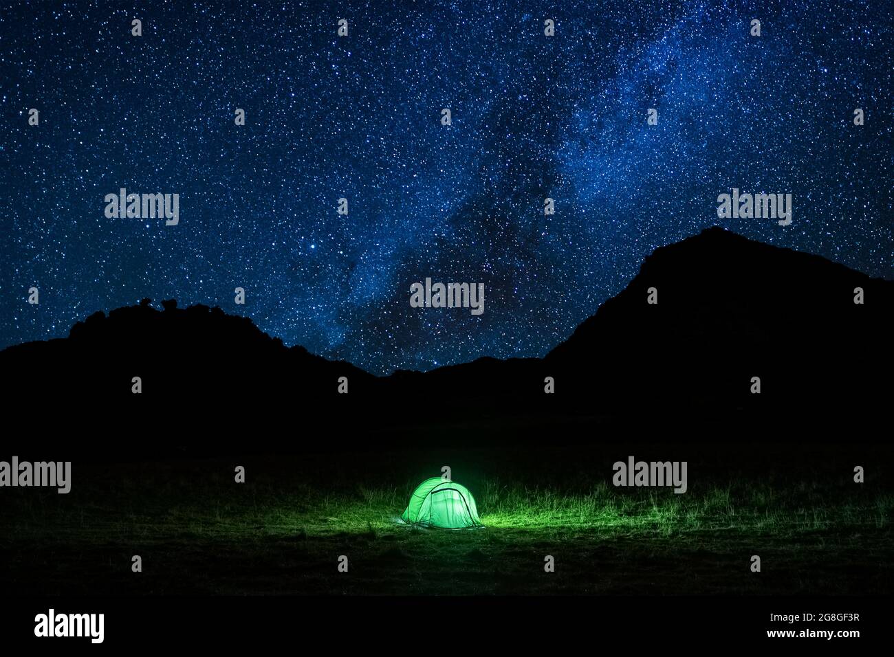 Tent glowing under a starry summer night in the countryside. Tent ...