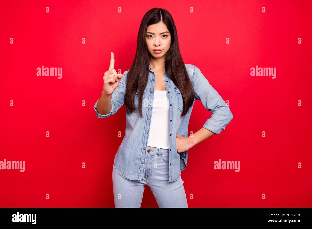 Portrait Of Attractive Strict Bossy Girl Showing Forefinger Up Caution Isolated Over Bright Red 1893