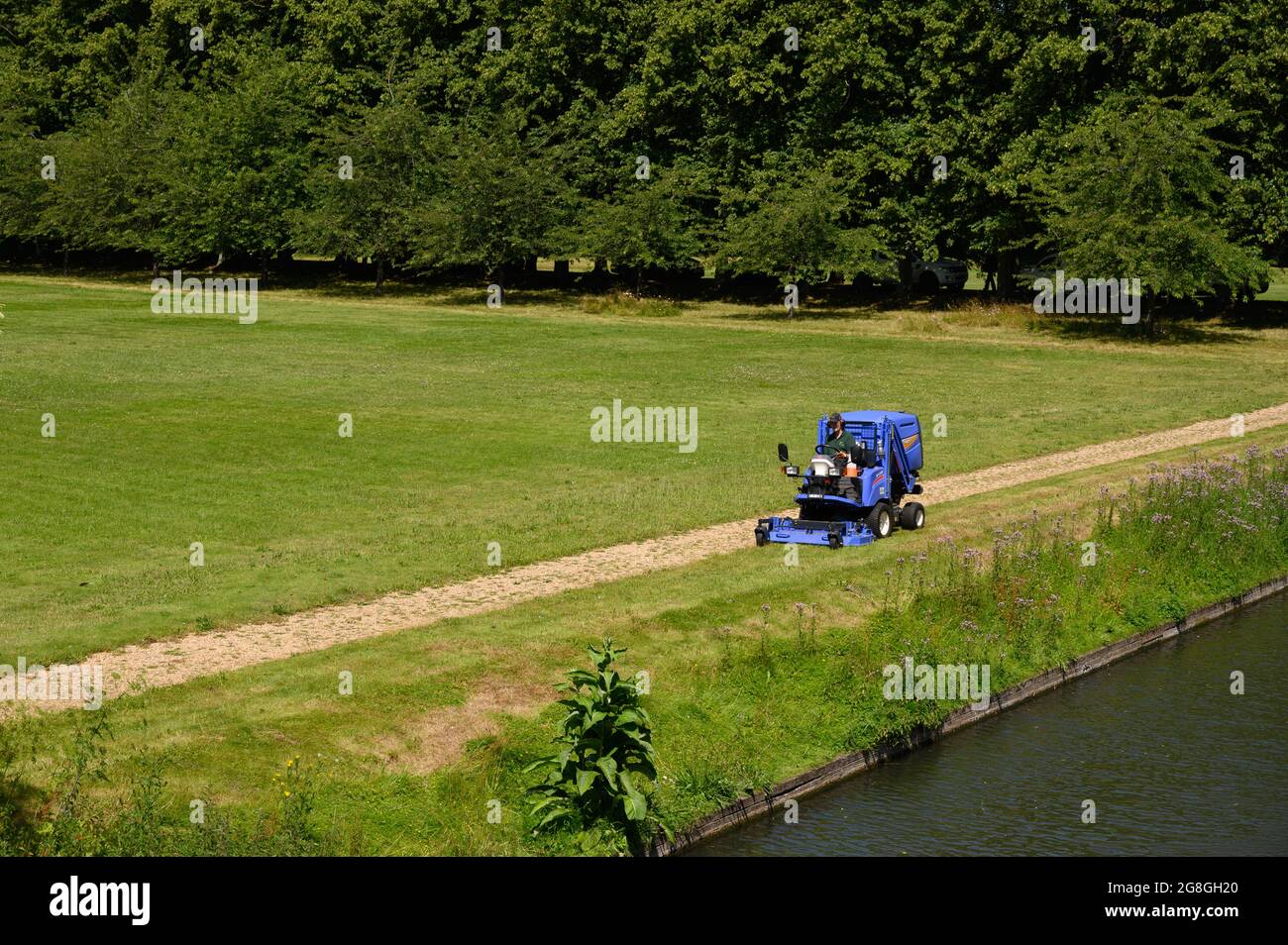 Lawn mower or grass cutting machine in the grounds of the University of Cambridge. Stock Photo