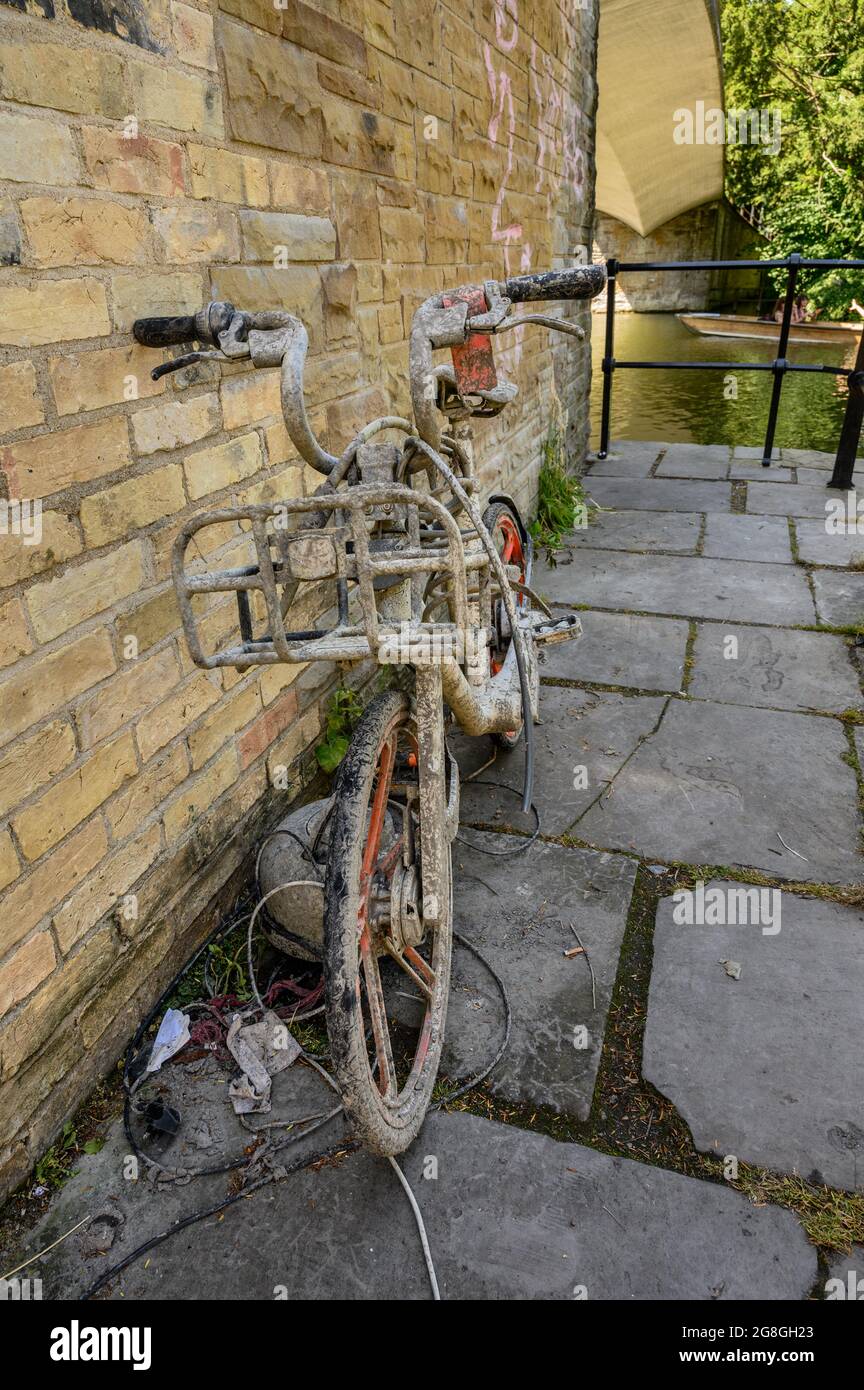 Muddy bike that has been pulled from a river. Stock Photo