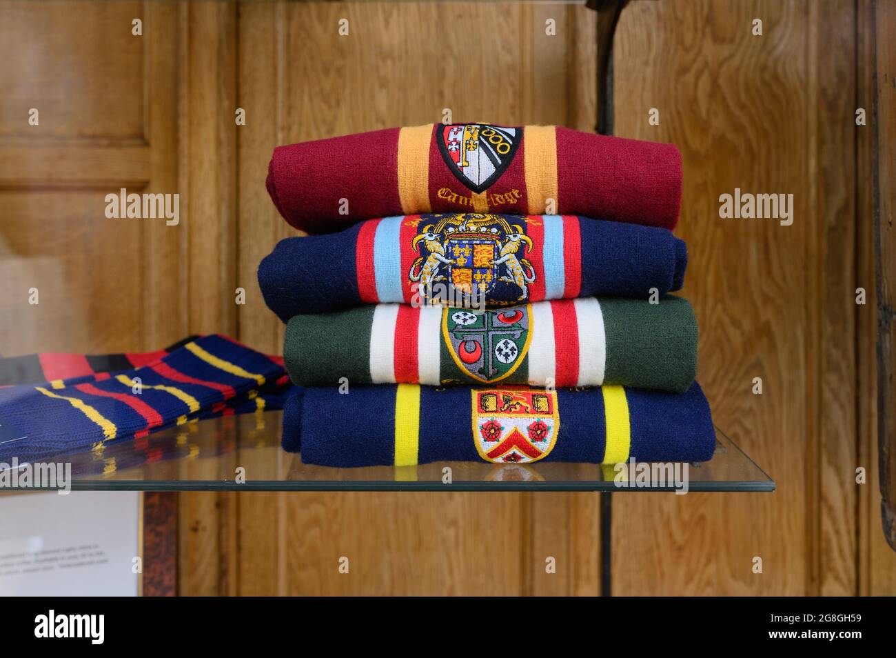 University of Cambridge college scarves on display in a shop window. Stock Photo