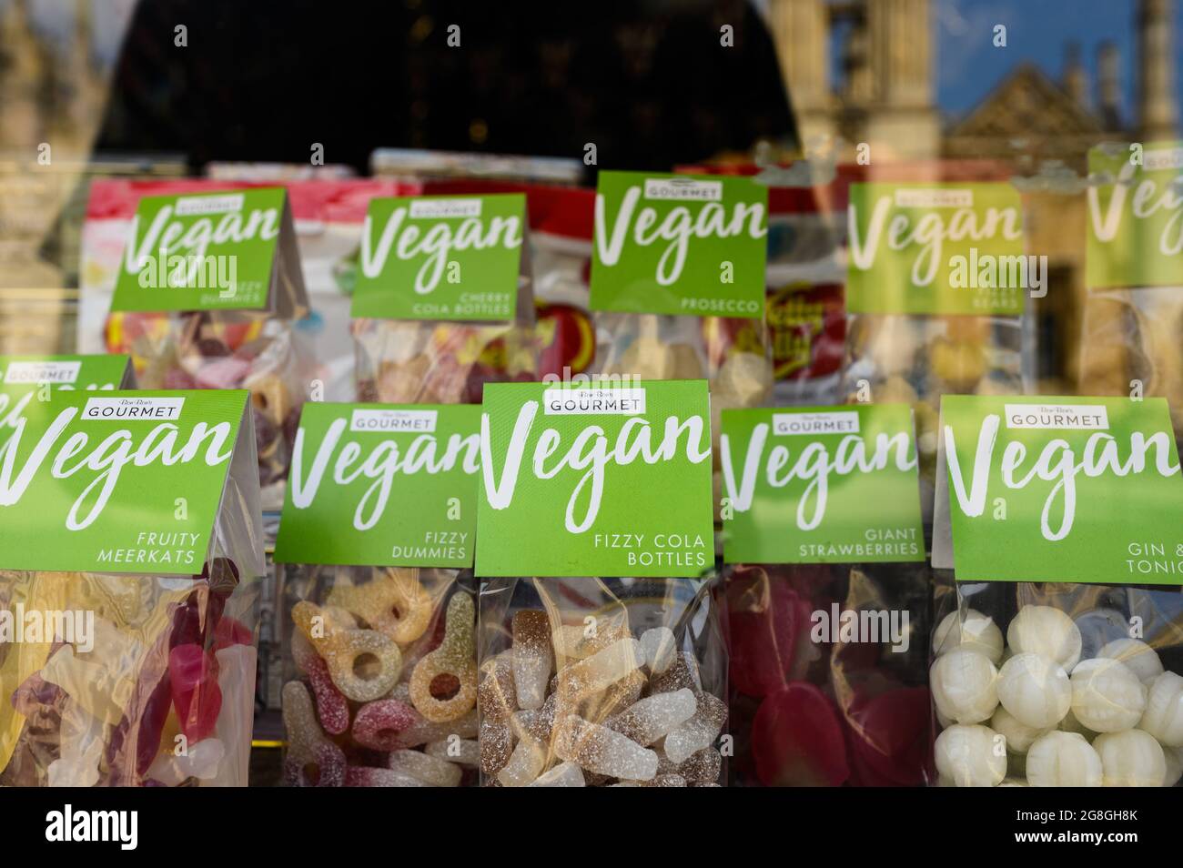 Vegan sweets (candy) on display in a shop window. Stock Photo