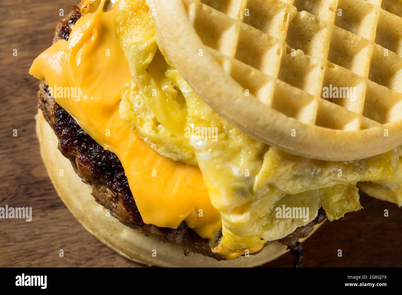 Homemade Waffle Breakfast Egg Sandwich with Cheese and Sausage Stock