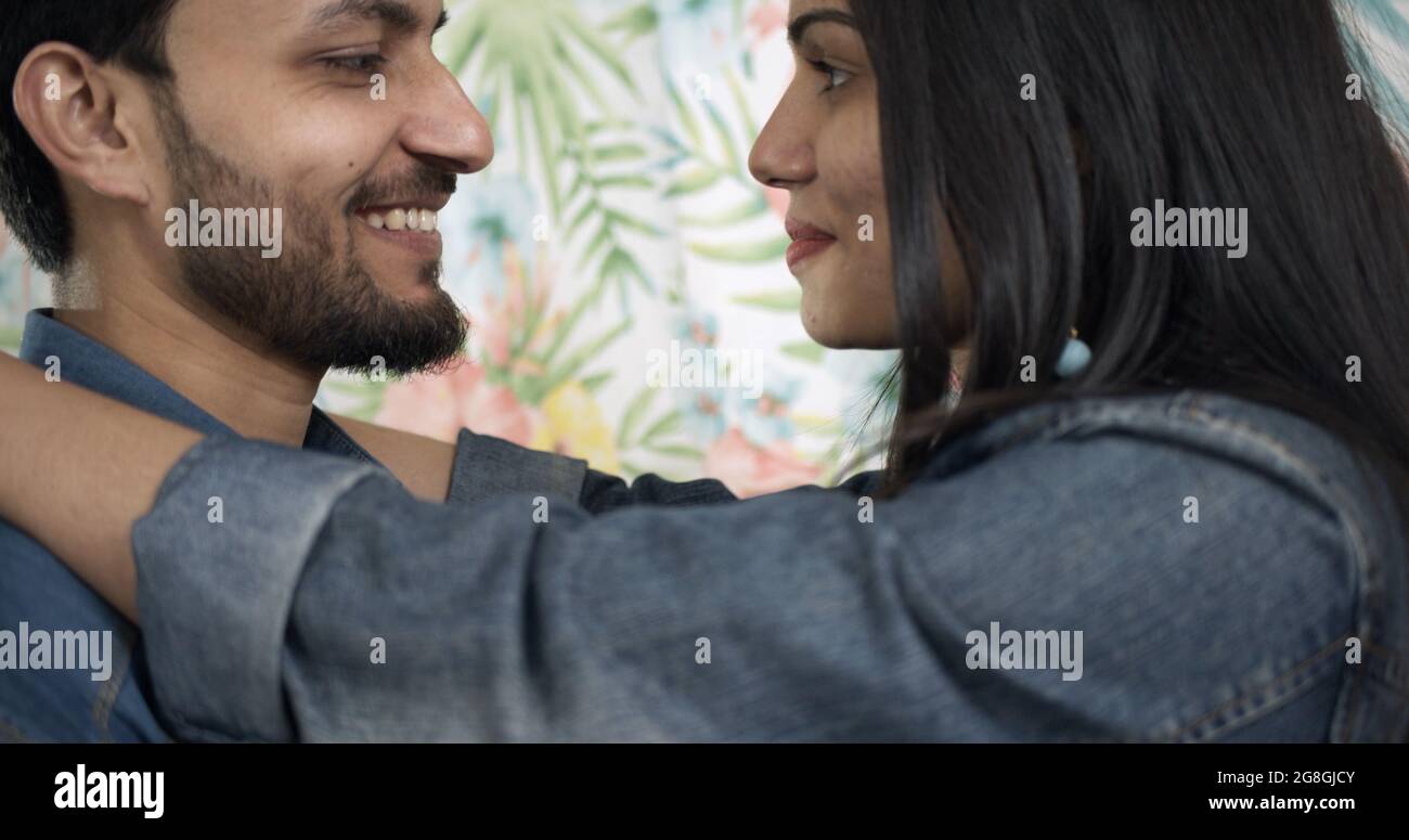 Young Indian couple hugging each other and showing affection on ...