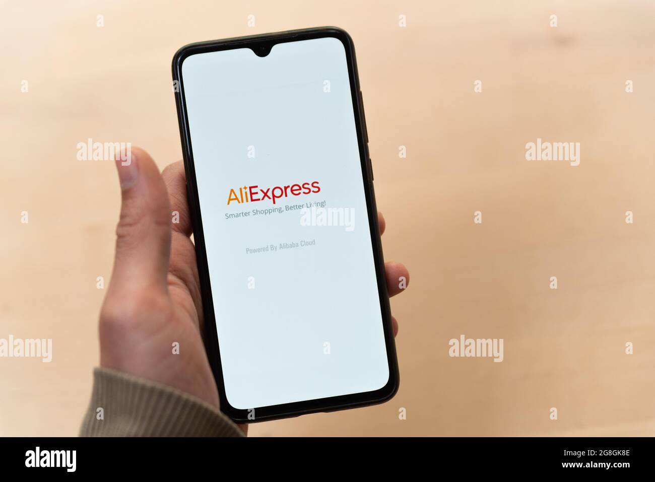A hand holds a mobile phone with the popular chinese e-commerce Aliexpress  mobile app logo in the display in Barcelona, Spain on July 18 2021.  Aliexpress is a popular online shopping app