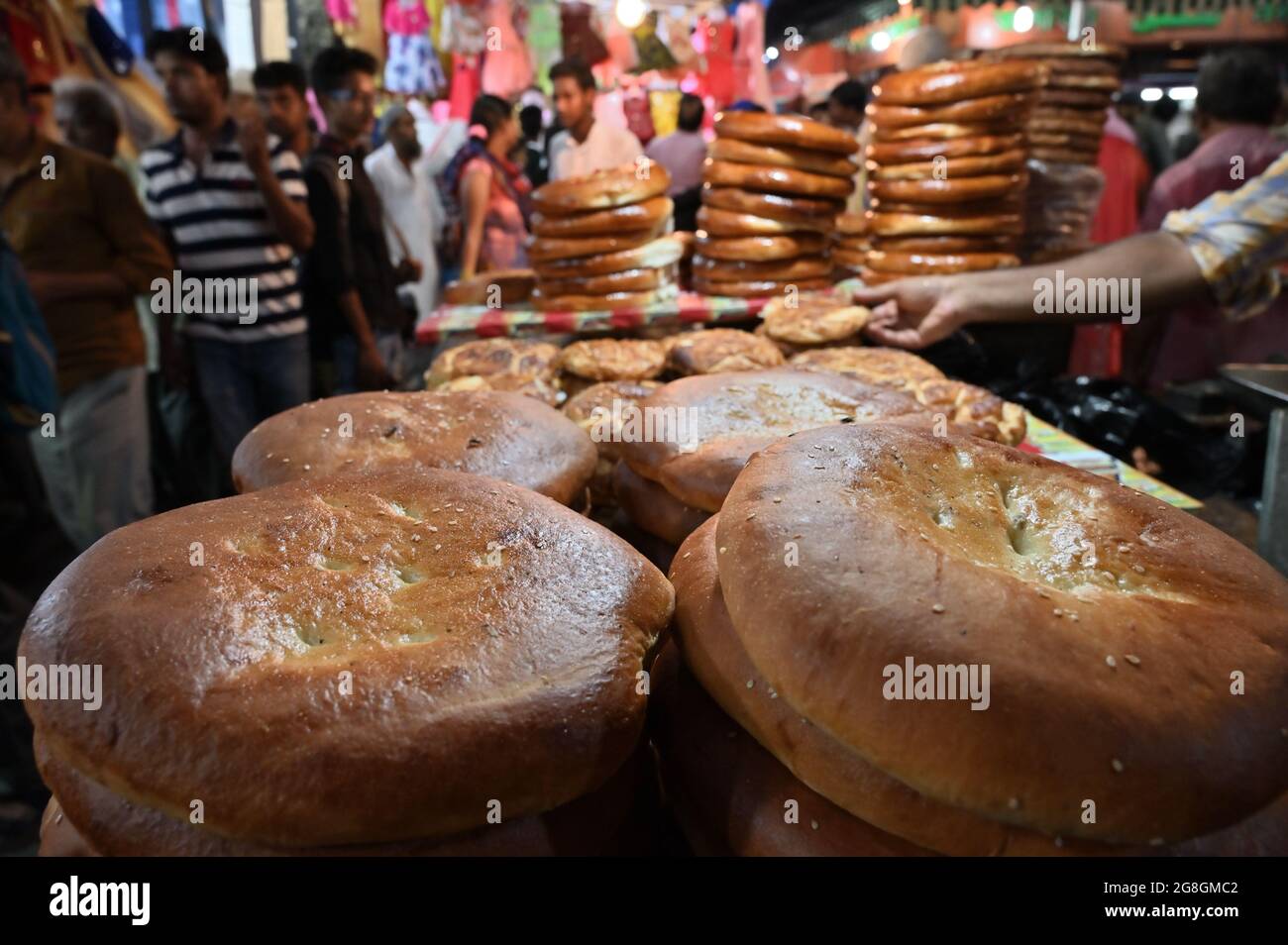 KOLKATA, WEST BENGAL, INDIA - MAY 27 2019 : Various sized fresh baked breads are stcked up for sale as street food in Zakaria street. Stock Photo