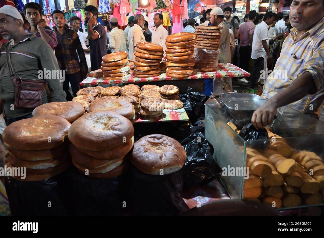 KOLKATA, WEST BENGAL, INDIA - MAY 27 2019 : Various sized fresh baked breads are stcked up for sale as street food in Zakaria street. Stock Photo