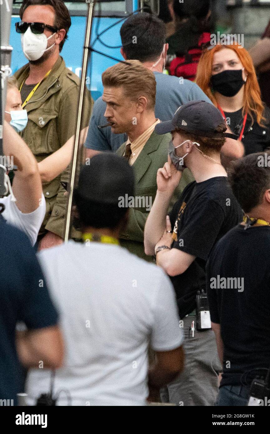 Glasgow, Scotland, UK. 20th July, 2021. PICTURED: Boyd Holbrook seen in between takes on set. Filming on the set of Indiana Jones 5 in the middle of Glasgow city centre as the Hollywood blockbuster sets up Glasgow as New York City. A full production can be seen, with a large cast, producers and extras. The city centre has been changed so that all the shop fronts and building look like 1959 America. Credit: Colin Fisher/Alamy Live News Stock Photo