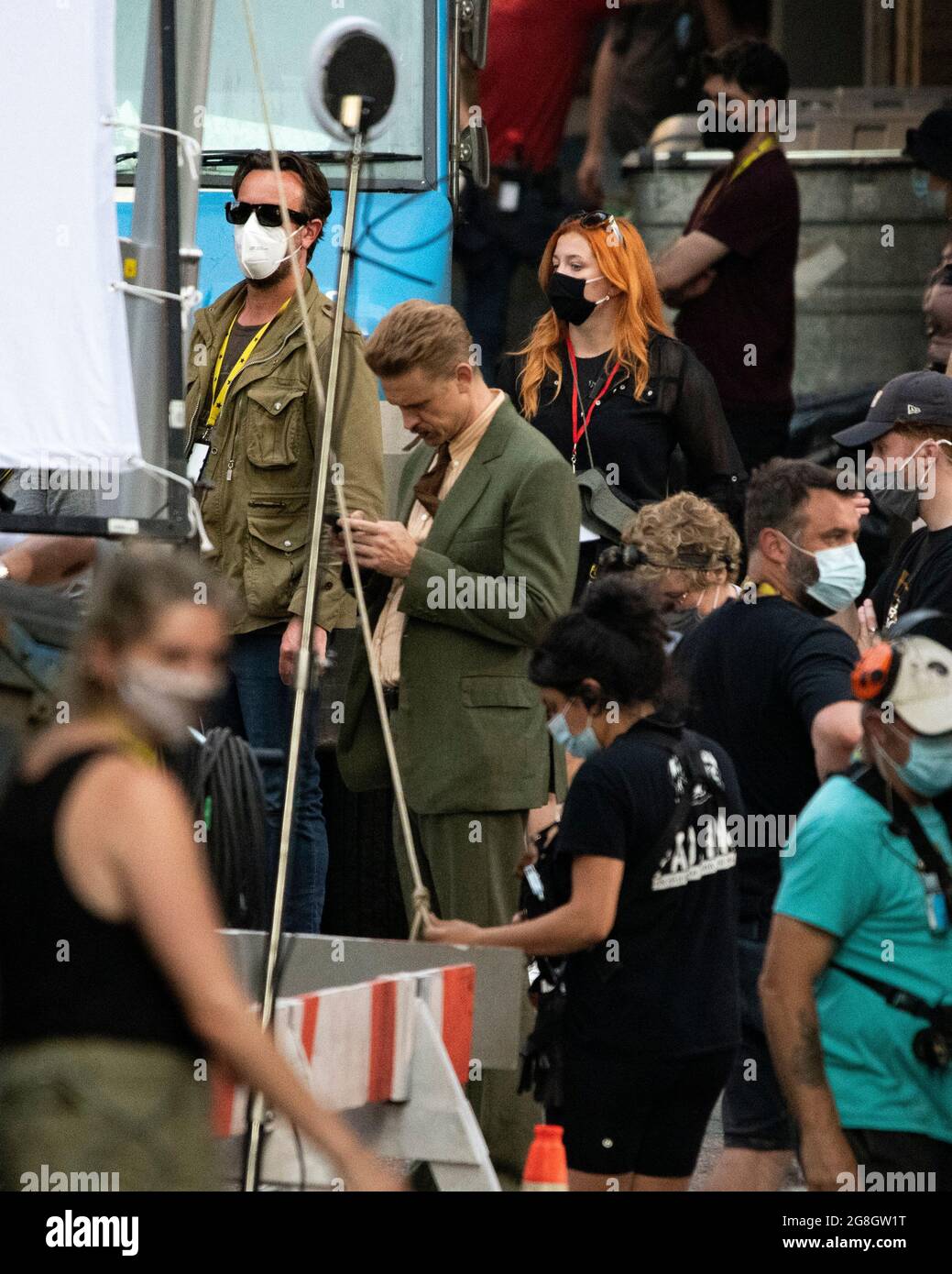 Glasgow, Scotland, UK. 20th July, 2021. PICTURED: Boyd Holbrook seen in between takes on set. Filming on the set of Indiana Jones 5 in the middle of Glasgow city centre as the Hollywood blockbuster sets up Glasgow as New York City. A full production can be seen, with a large cast, producers and extras. The city centre has been changed so that all the shop fronts and building look like 1959 America. Credit: Colin Fisher/Alamy Live News Stock Photo
