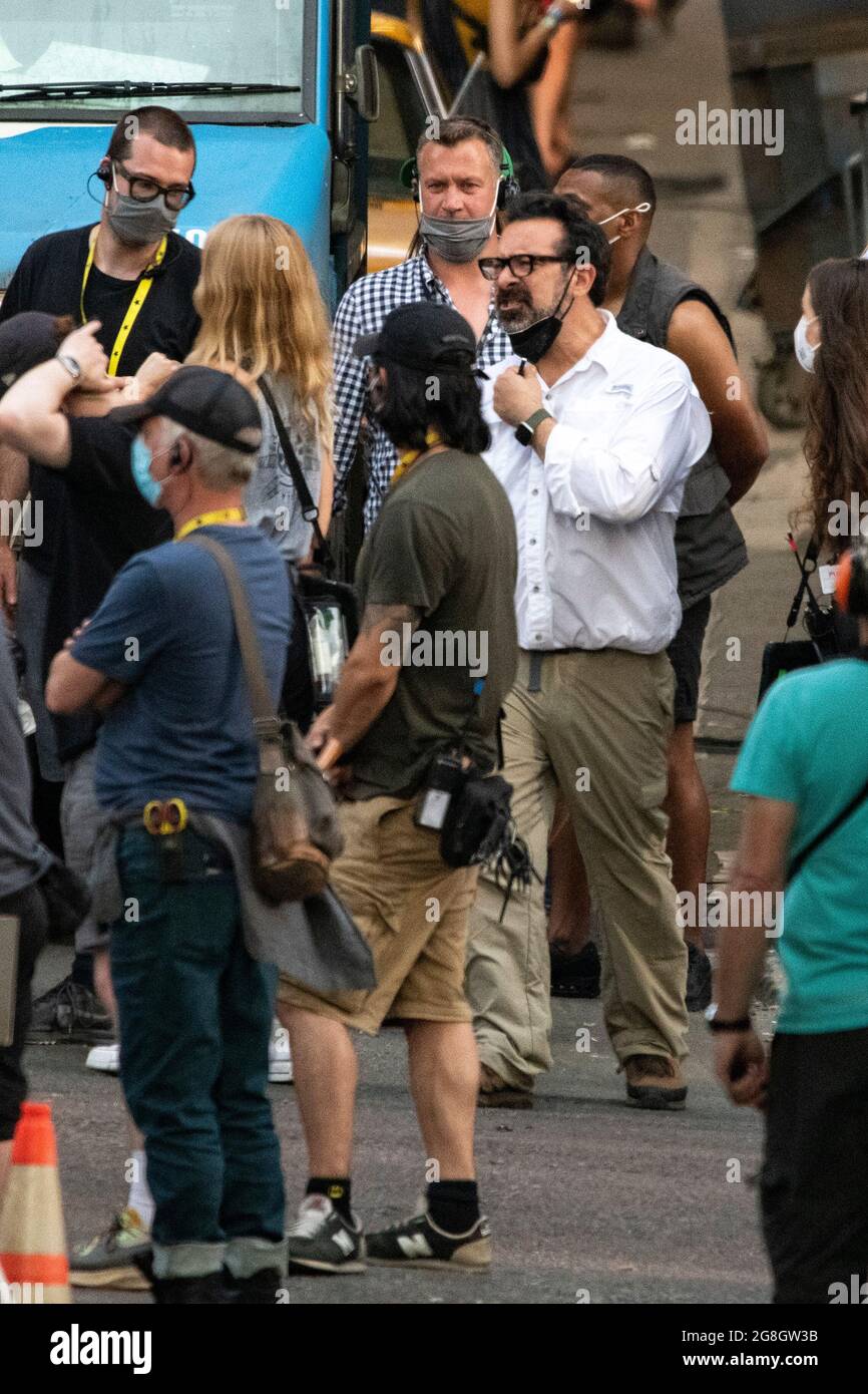 Glasgow, Scotland, UK. 20th July, 2021. PICTURED: The films producer and director, James Mangold seen in white and dark glasses seen in between takes on set. Filming on the set of Indiana Jones 5 in the middle of Glasgow city centre as the Hollywood blockbuster sets up Glasgow as New York City. A full production can be seen, with a large cast, producers and extras. The city centre has been changed so that all the shop fronts and building look like 1959 America. Credit: Colin Fisher/Alamy Live News Stock Photo