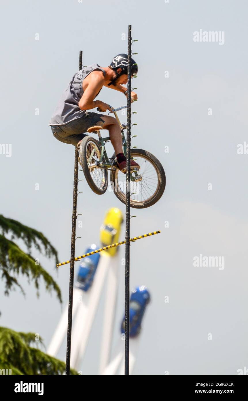 BMX high jump stunt rider at the Goodwood Festival of Speed event, UK