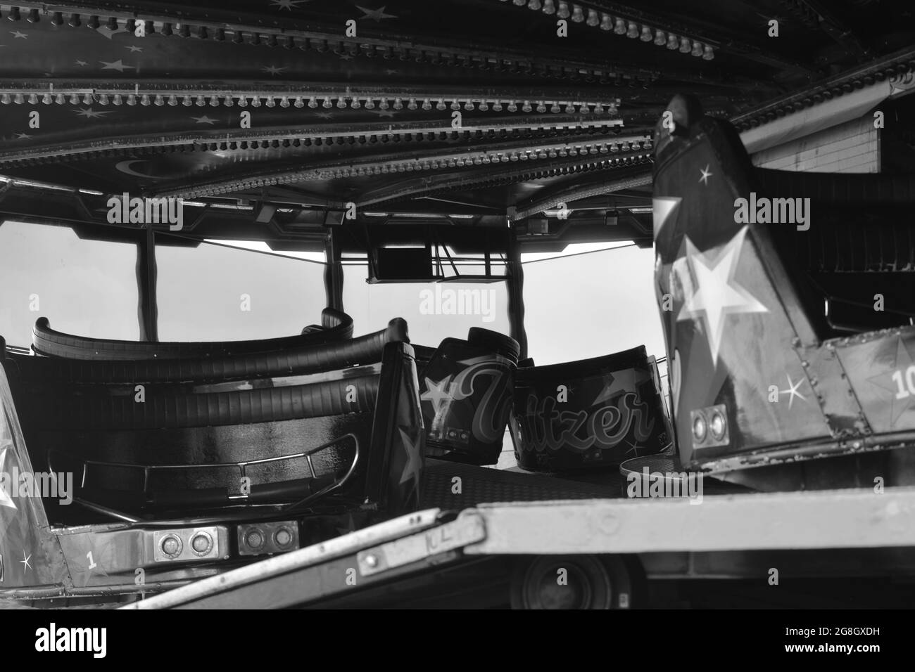 Monochrome image nostalgic summer vacation vibes, fairgrounds rides